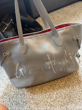 Gray Tote Bag with Red Interior and Script Logo Accent